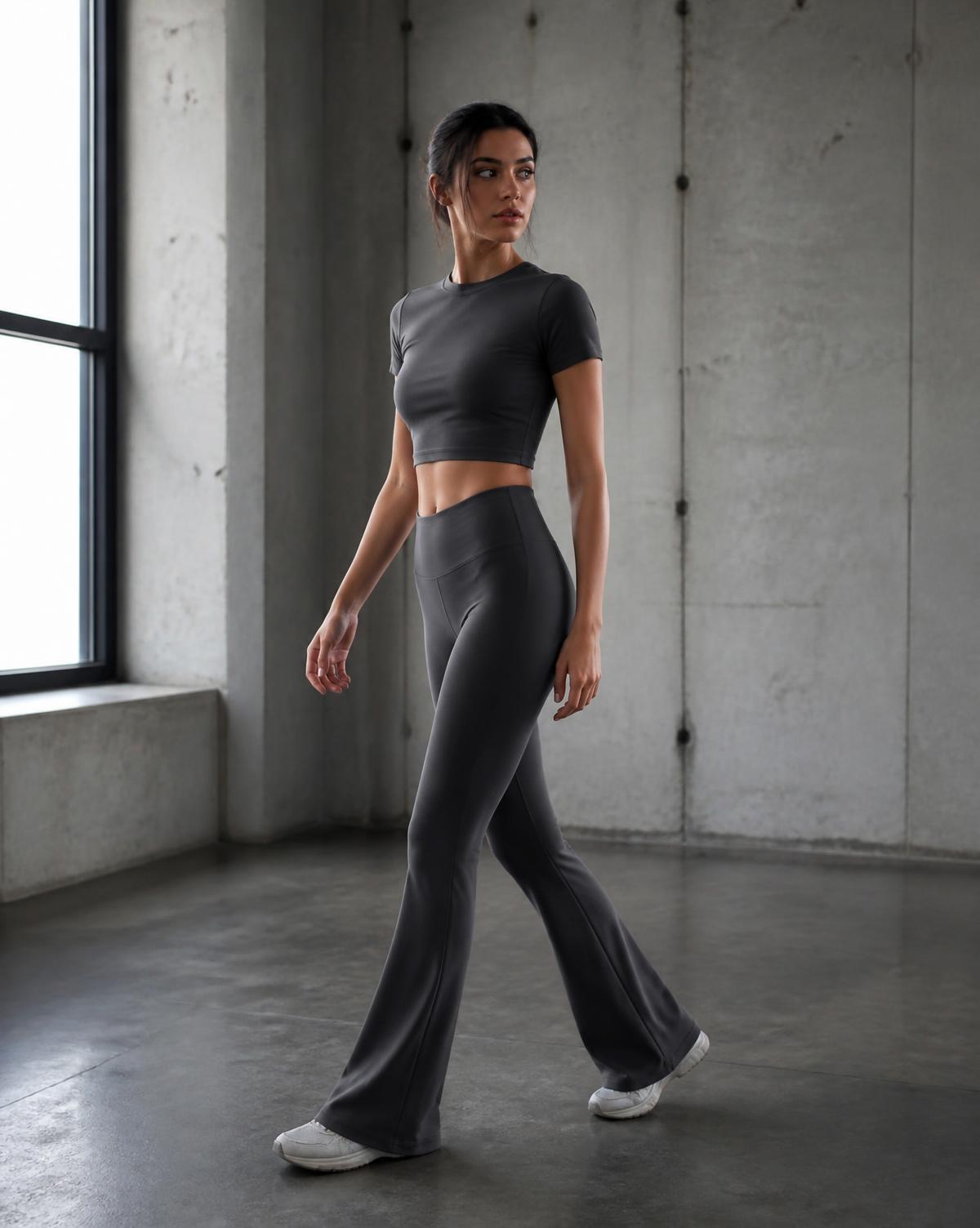 Woman in charcoal activewear mid-stride